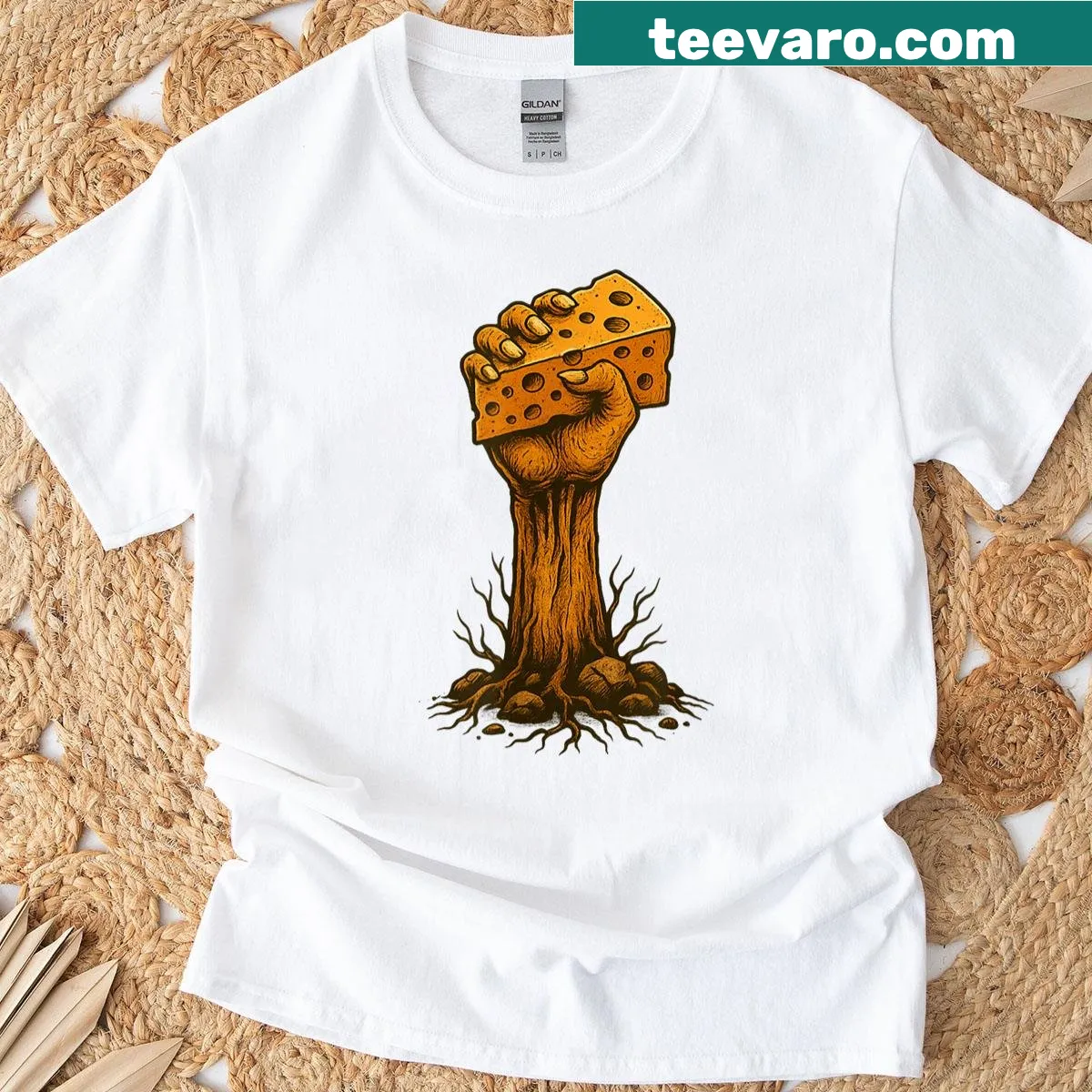 Shirt featuring a whimsical hand graphic with cheesy character design. — on a men's t-shirt