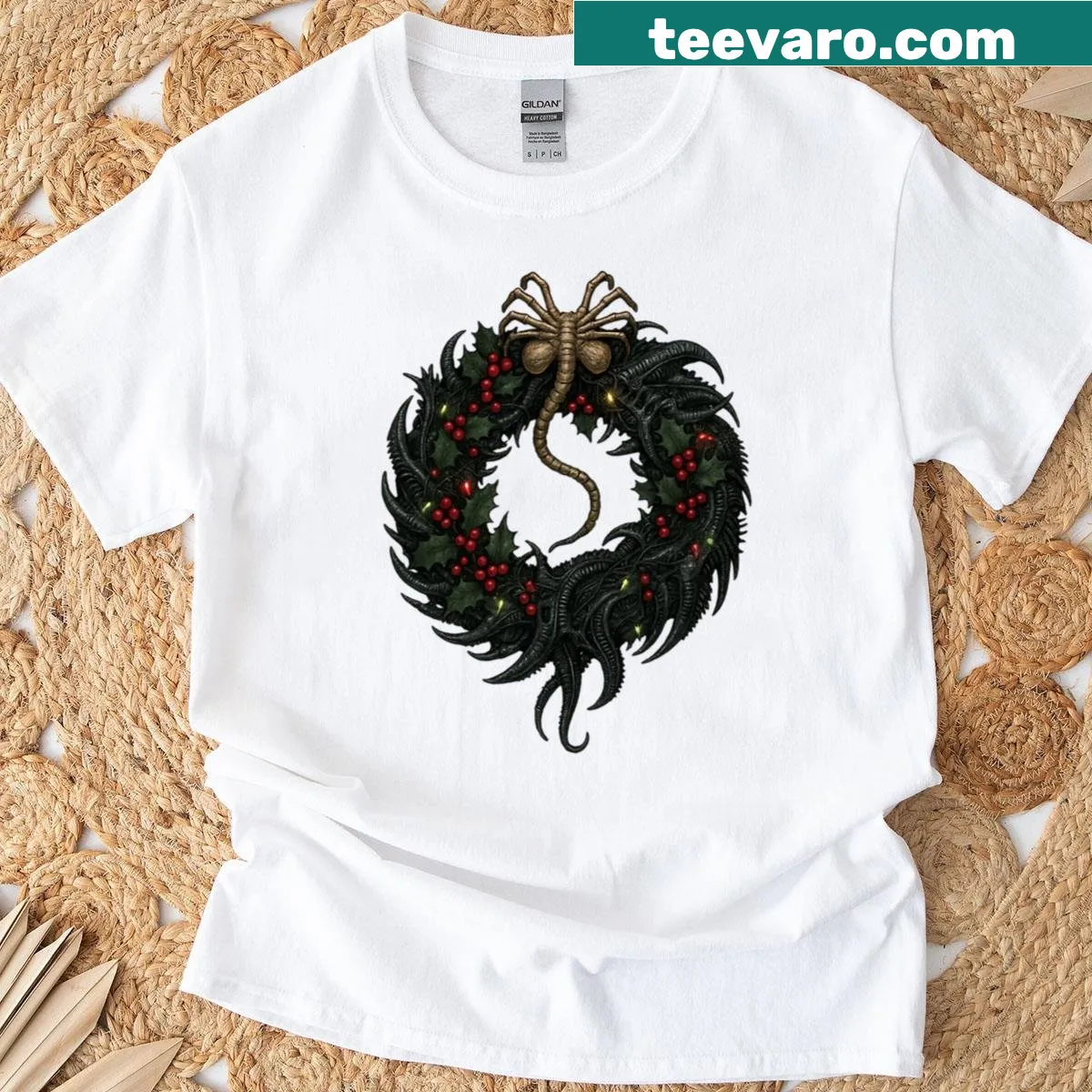 T-shirt featuring a Christmas wreath and Xenomorph facehugger design. — on a men's t-shirt