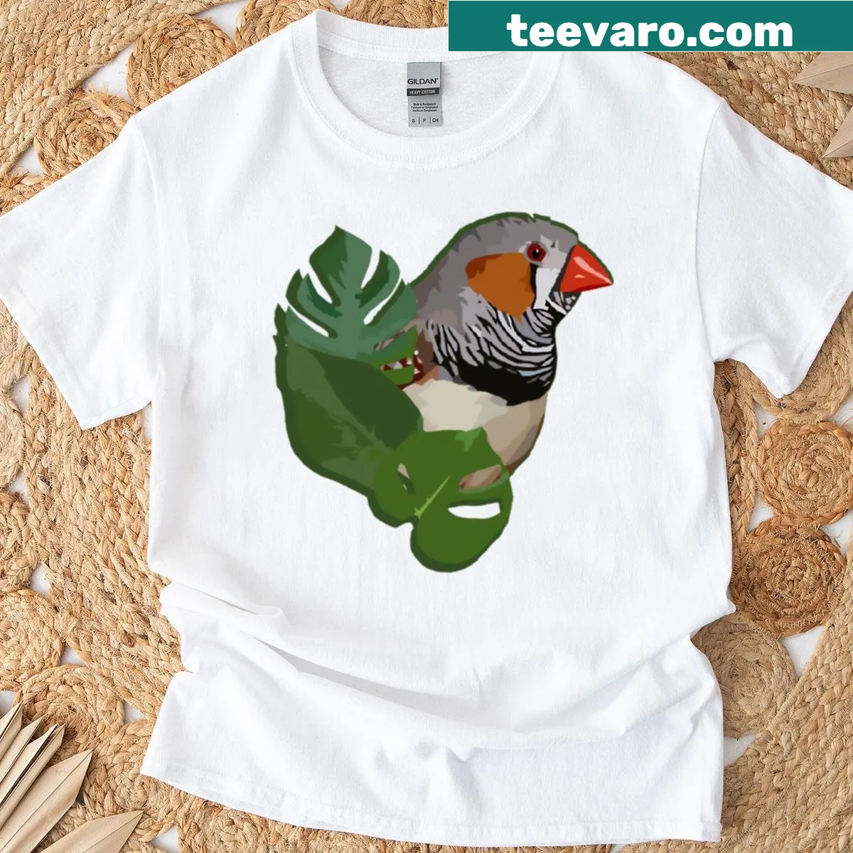 Zebra finch illustration with monstera leaves on T-shirt — on a men's t-shirt
