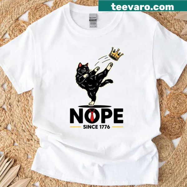 Funny cat kicking crown design T-shirt with whimsical art