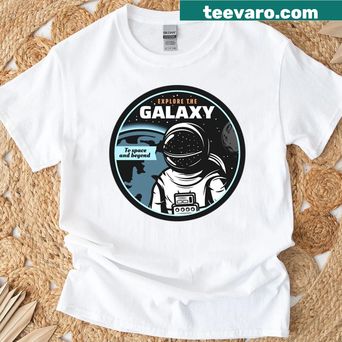 Astronaut graphic exploring space with stars and planets — on a men's t-shirt