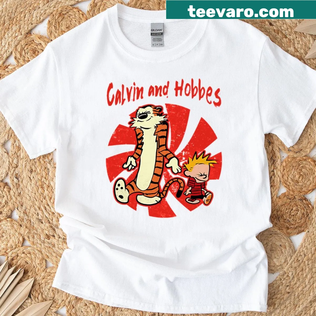 T-shirt featuring playful graphics of Calvin and Hobbes from the comic strip — on a men's t-shirt
