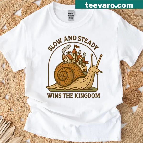 Whimsical snail village illustration on a fantasy T-shirt