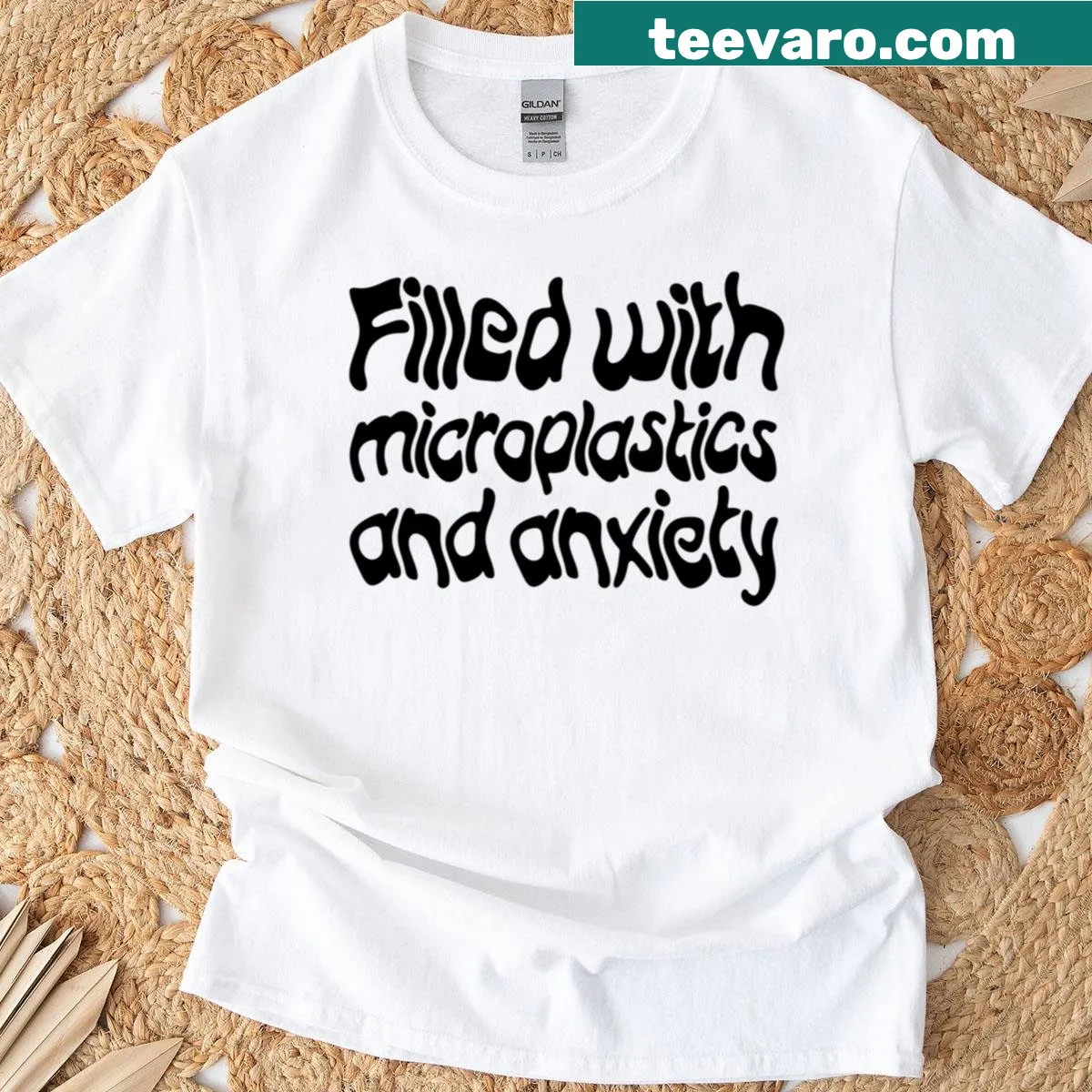 Black T-shirt with the phrase 'Filled With Microplastics And Anxiety' — on a men's t-shirt