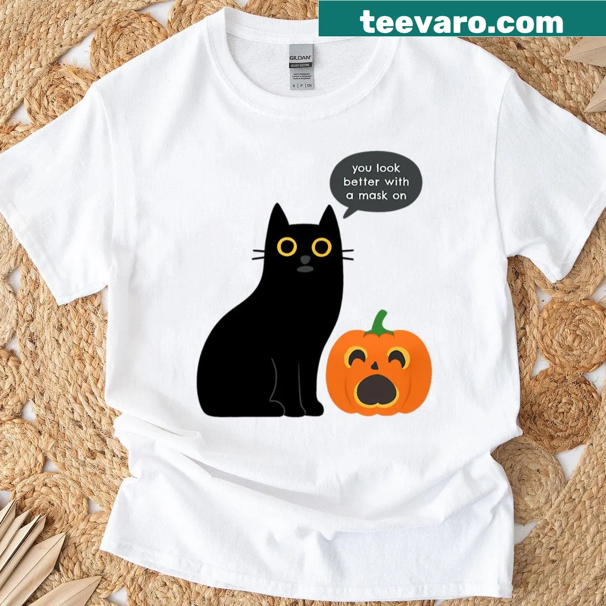 Funny black cat and pumpkin graphic on an oversized T-shirt — on a men's t-shirt