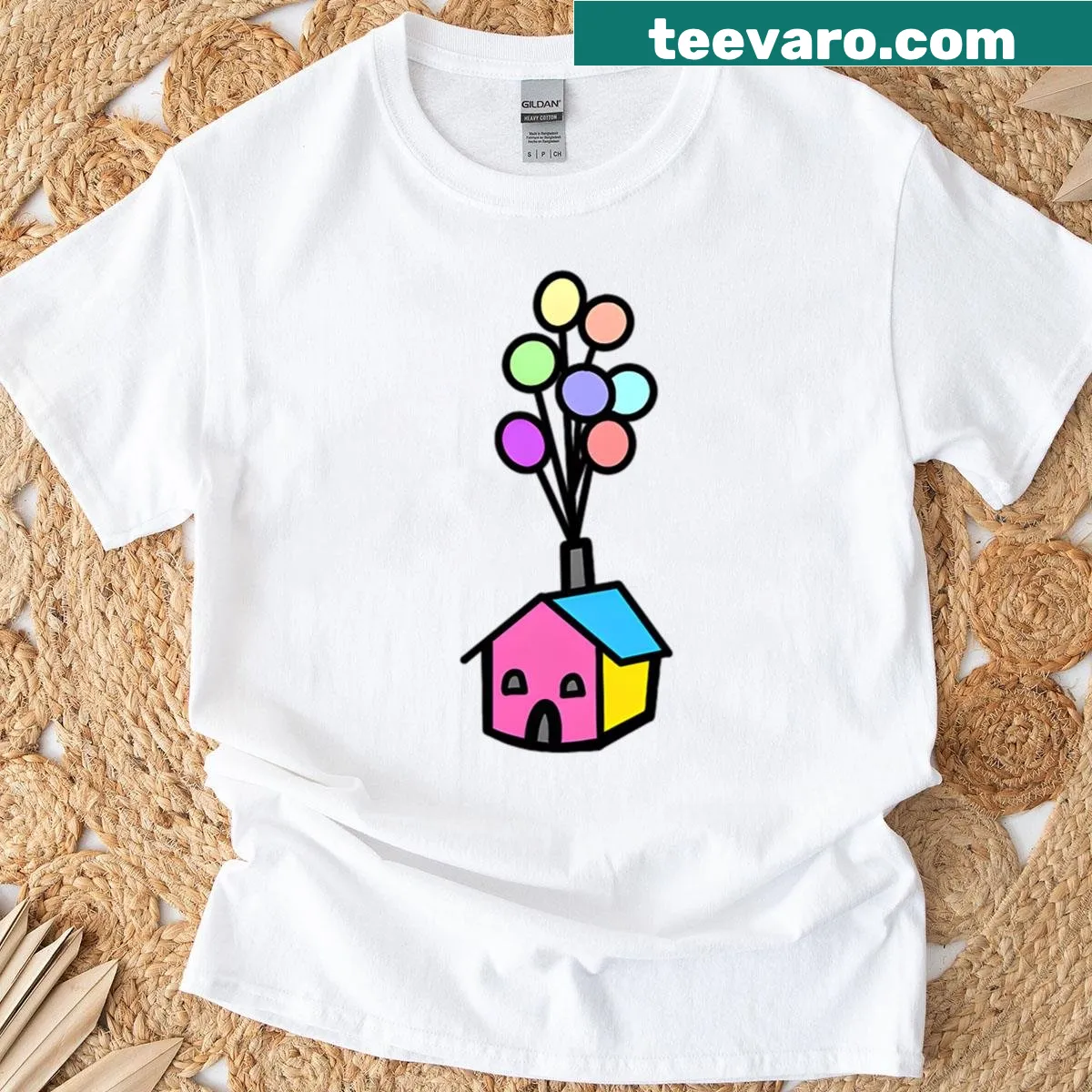 Illustration of the tiny house from Up lifted by balloons — on a men's t-shirt