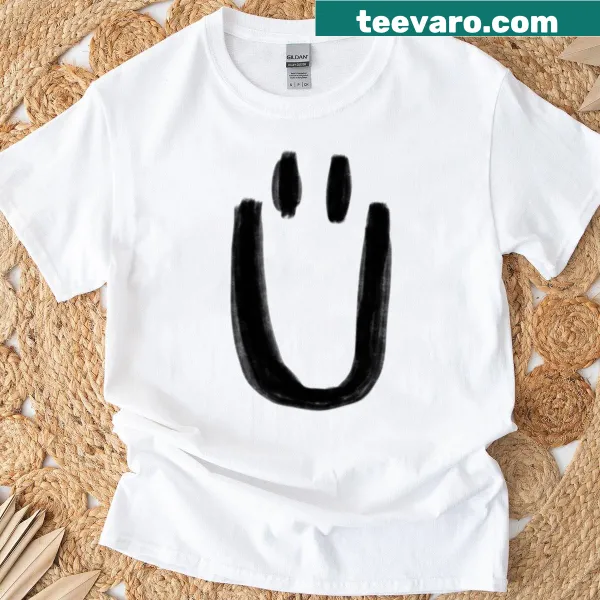 Minimalist umlaut symbol graphic on a T-shirt