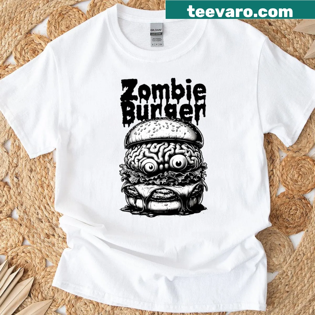 Grayscale cartoon T-shirt featuring a zombie burger with brain filling — on a men's t-shirt