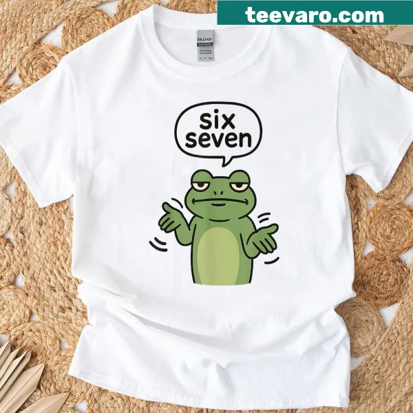 Funny frog design with '6 7' meme on a kid's t-shirt.