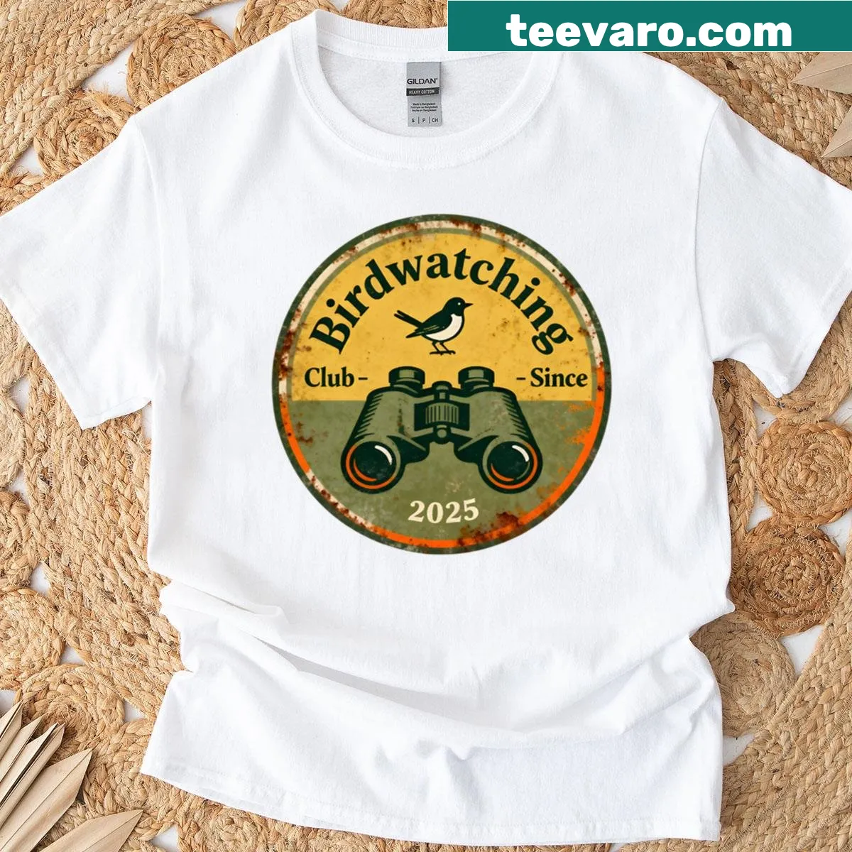 Vintage birdwatching badge T-shirt with retro bird graphics — on a men's t-shirt