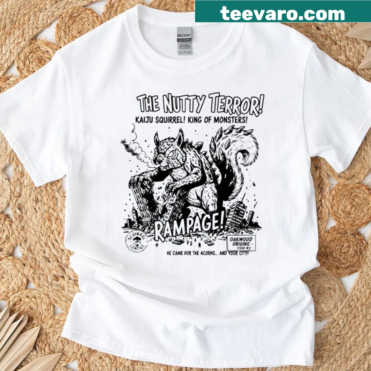 Whimsical kaiju-style squirrel graphic on black T-shirt — on a men's t-shirt