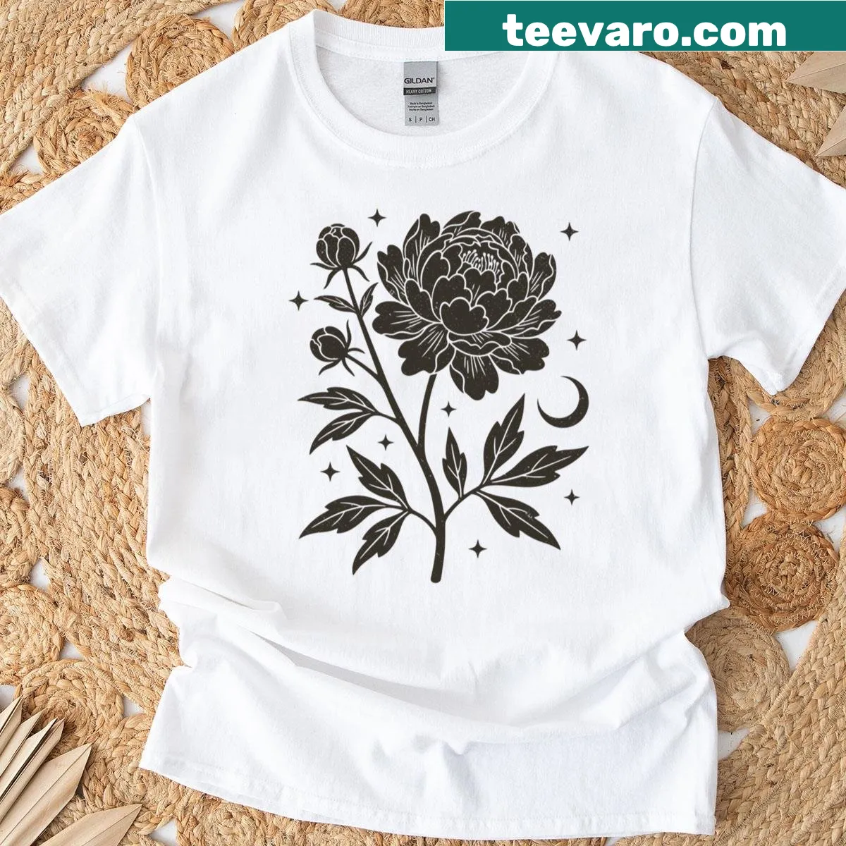 Vintage floral T-shirt with linocut roses and celestial moon design — on a men's t-shirt