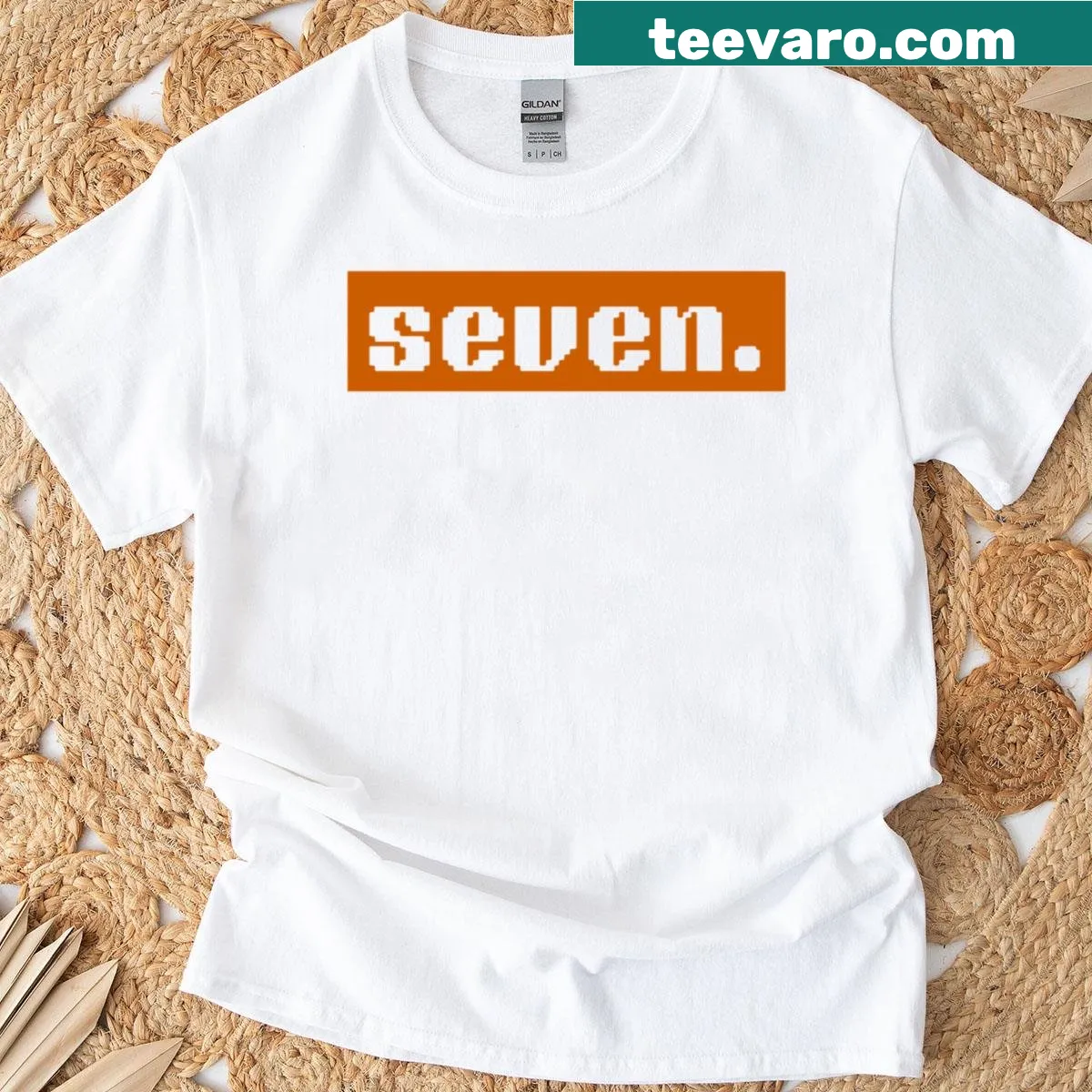 Minimalist design featuring the number seven in modern typography — on a men's t-shirt