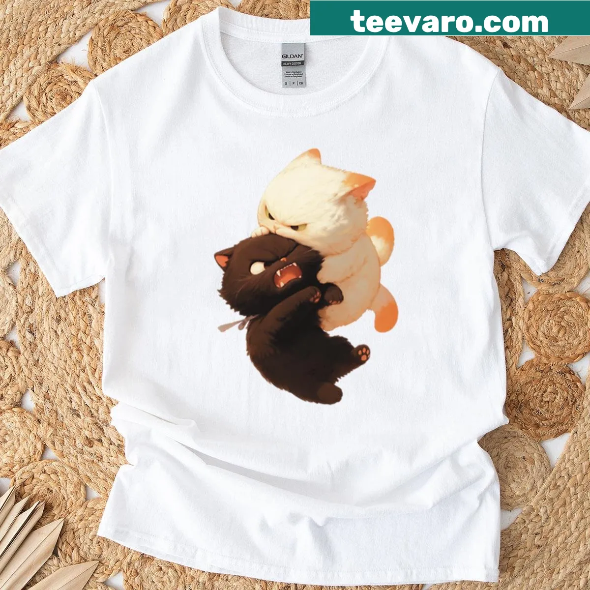 Cartoon graphic of playful cats battling on T-shirt — on a men's t-shirt