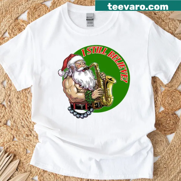 Cartoon Santa design with 'I Still Believe' text on an oversized t-shirt