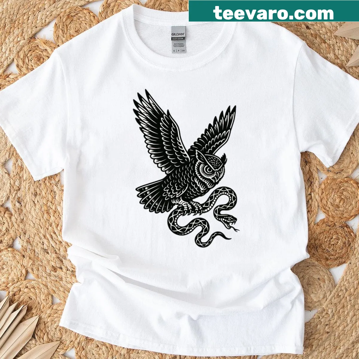 Illustration of an owl flying with a snake on a T-shirt — on a men's t-shirt