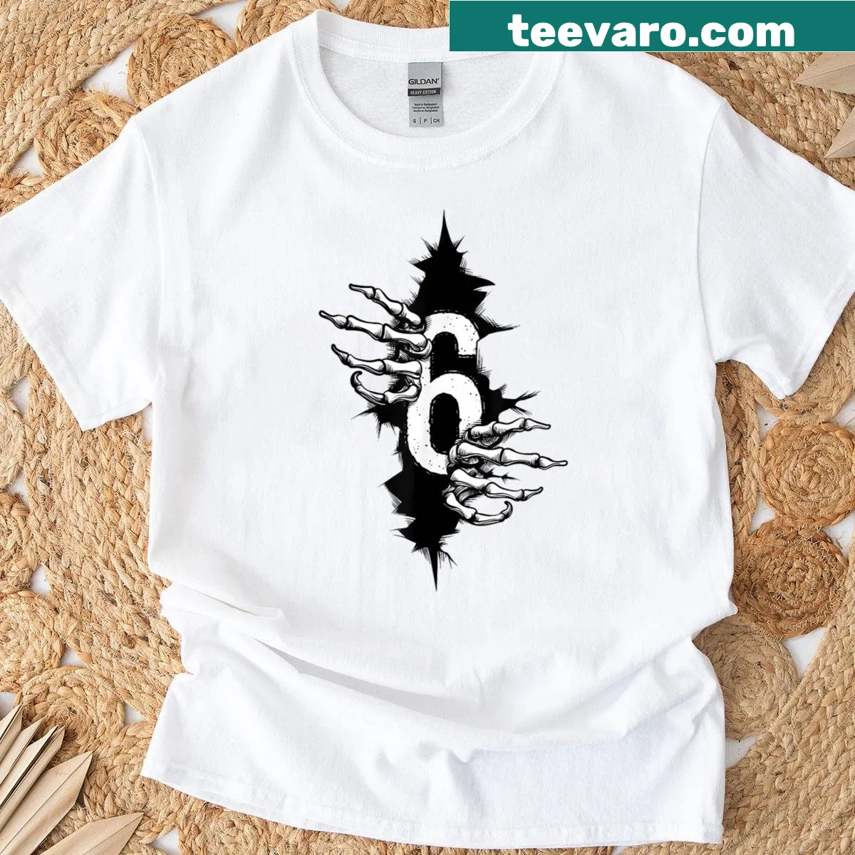 Skeleton hands breaking through a chest design on a humorous T-shirt — on a men's t-shirt