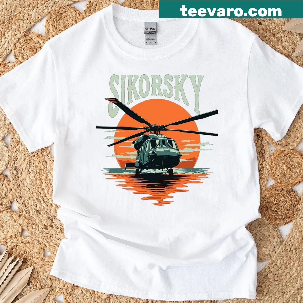 T-shirt featuring a badge design of the UH-60 Blackhawk helicopter — on a men's t-shirt