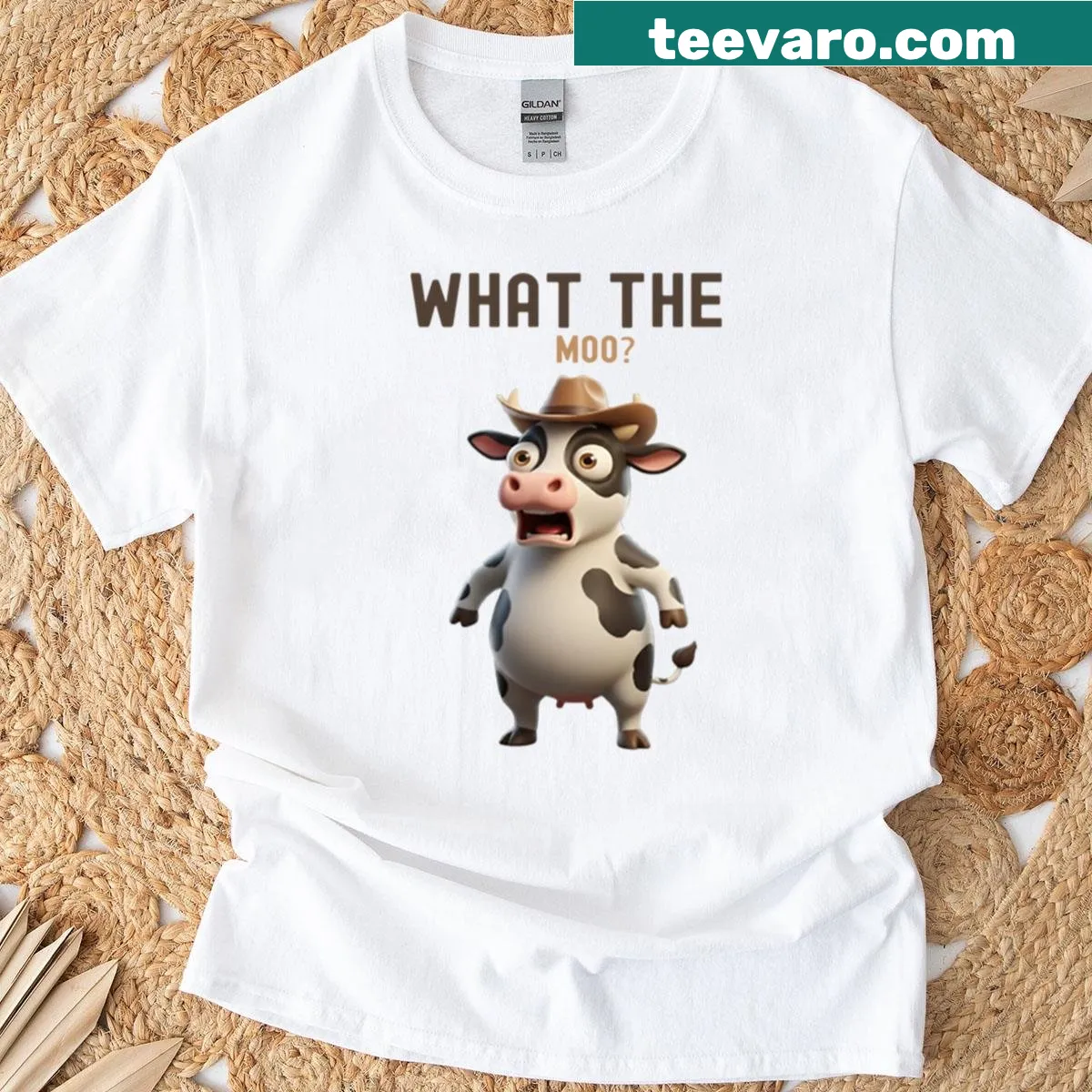 Humorous t-shirt featuring a cartoon cow and the phrase 'What The Moo' — on a men's t-shirt