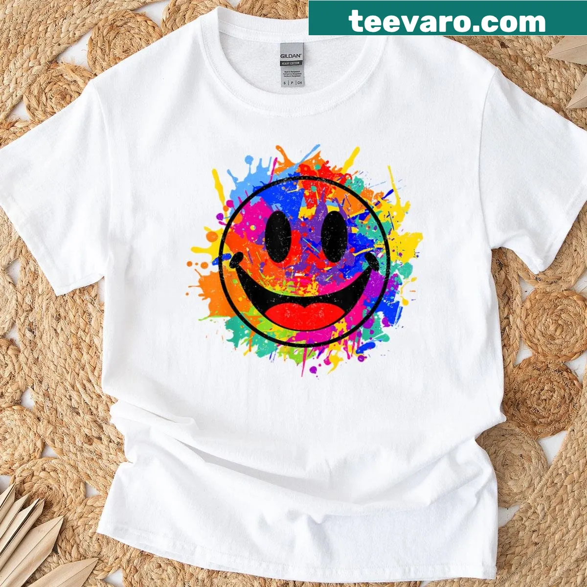 Retro 70s smiley face t-shirt with tie dye splatter design — on a men's t-shirt
