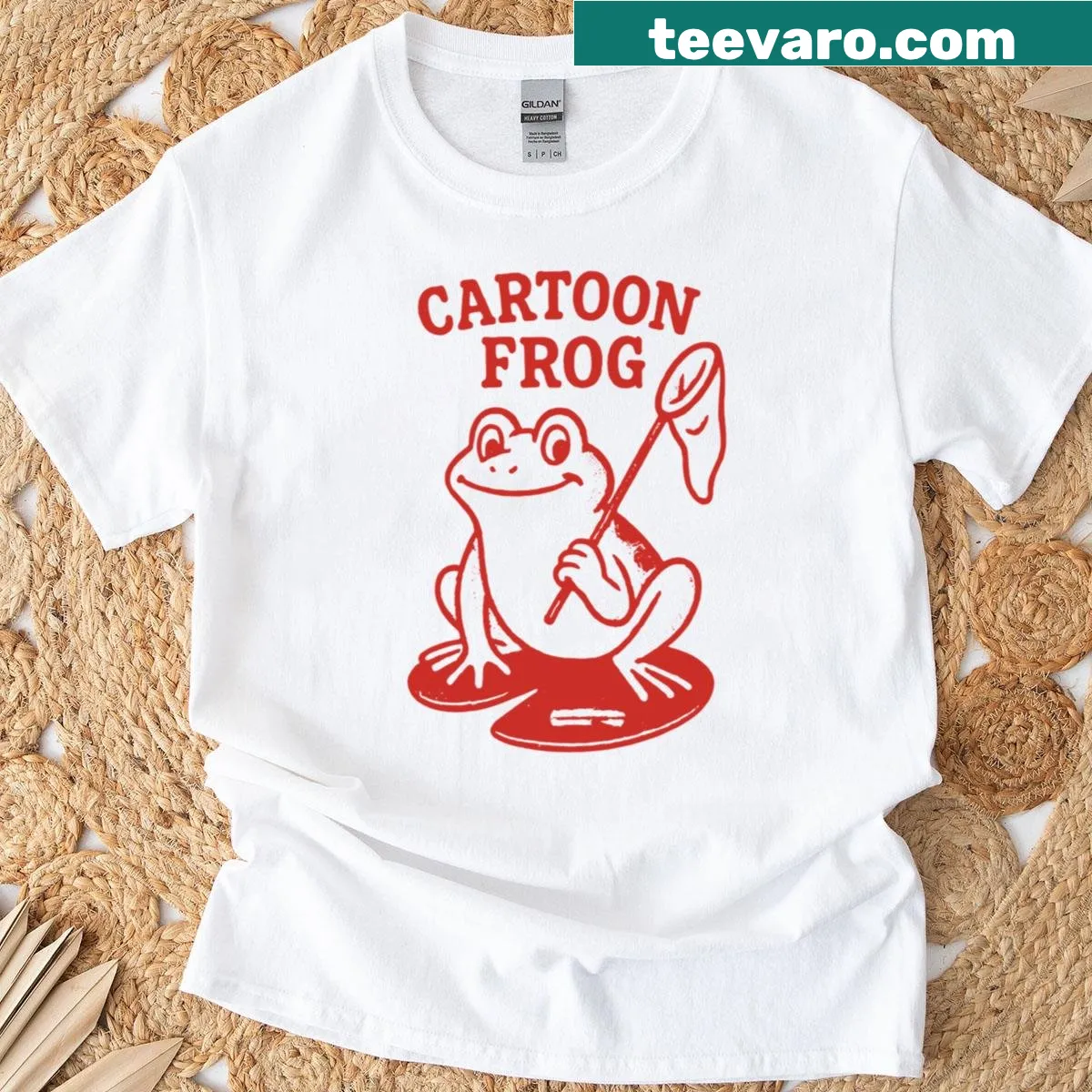 Playful cartoon frog catching fish on a kid's adventure t-shirt. — on a men's t-shirt