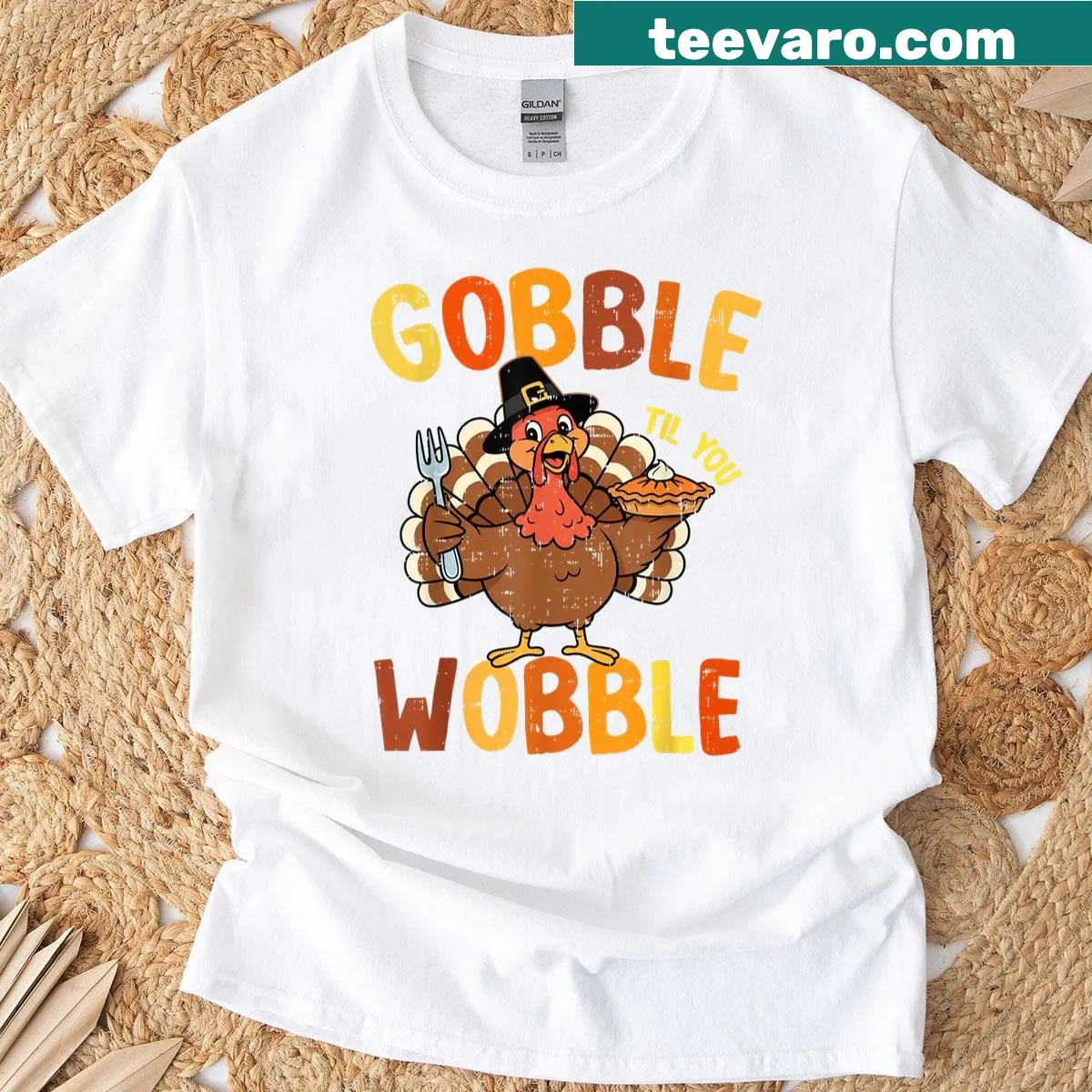 Funny t-shirt with the phrase 'Gobble Til You Wobble' for Thanksgiving — on a men's t-shirt