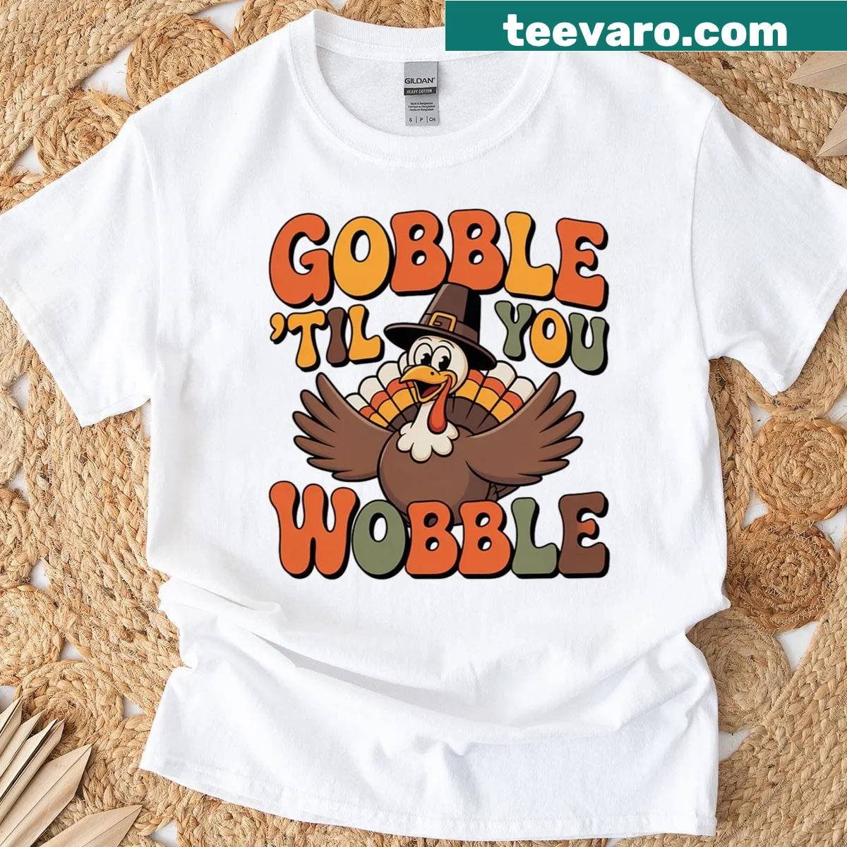 Funny Thanksgiving t-shirt with Gobble Til You Wobble text — on a men's t-shirt