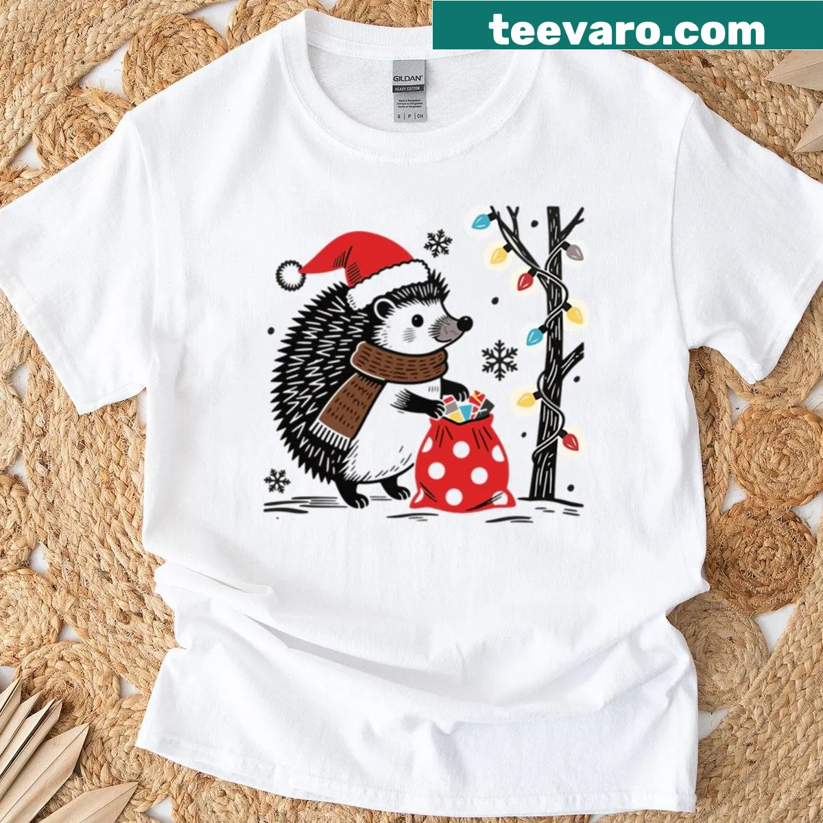 Christmas T-shirt featuring a hedgehog with a Santa hat silhouette — on a men's t-shirt