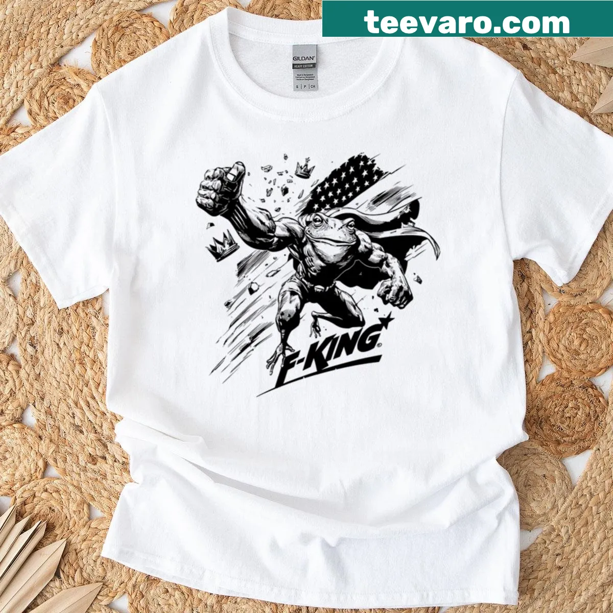 High-contrast frog graphic kicking a crown against an American flag — on a men's t-shirt