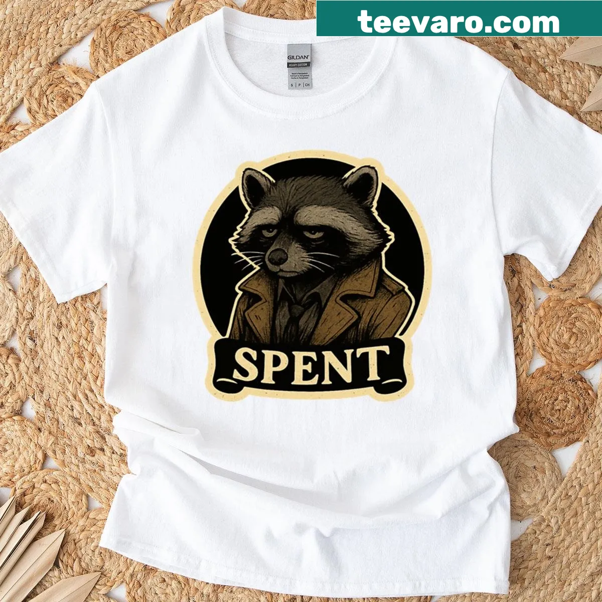 T-shirt featuring a trenchcoat raccoon emblem with noir style — on a men's t-shirt
