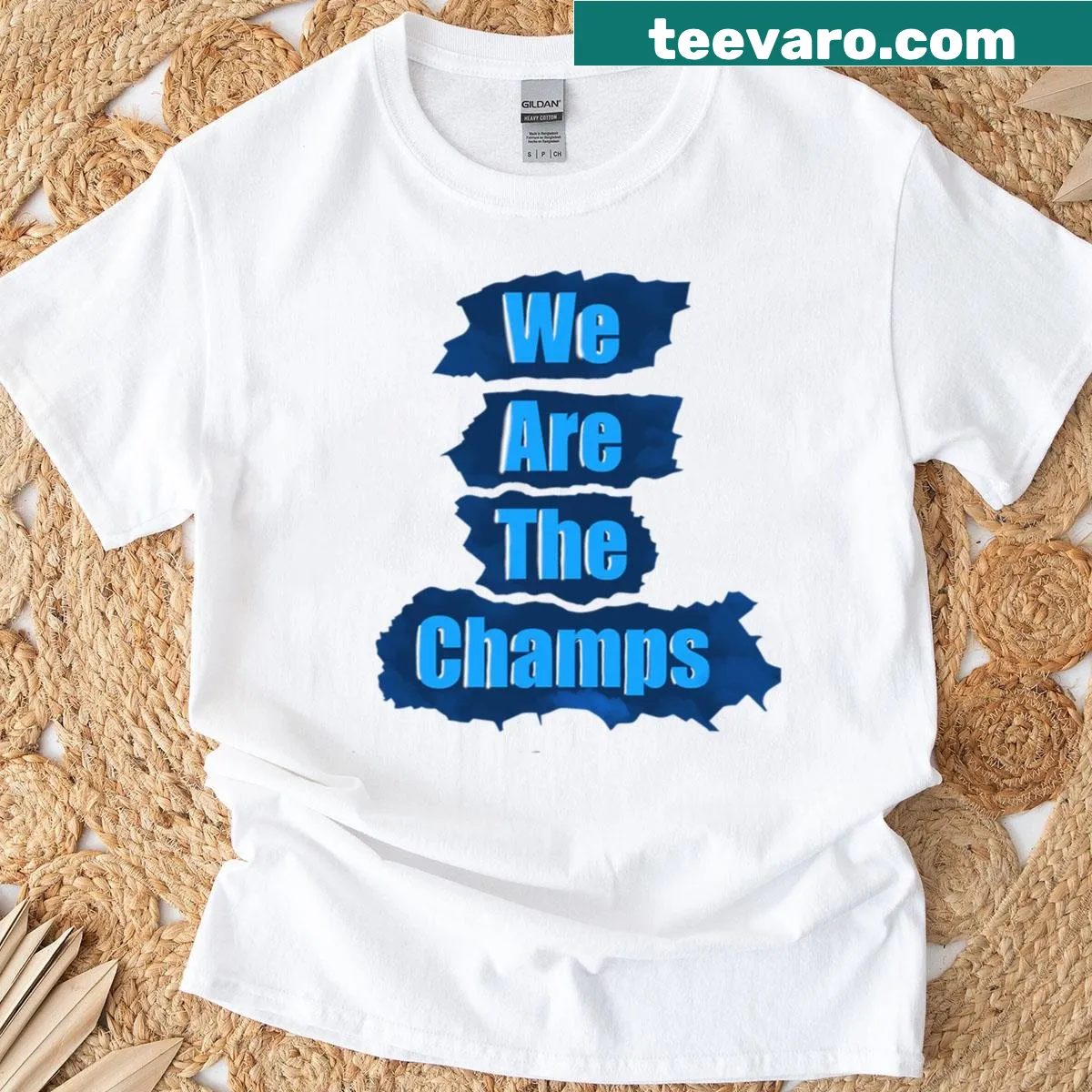 Motivational typography T-shirt celebrating champions — on a men's t-shirt