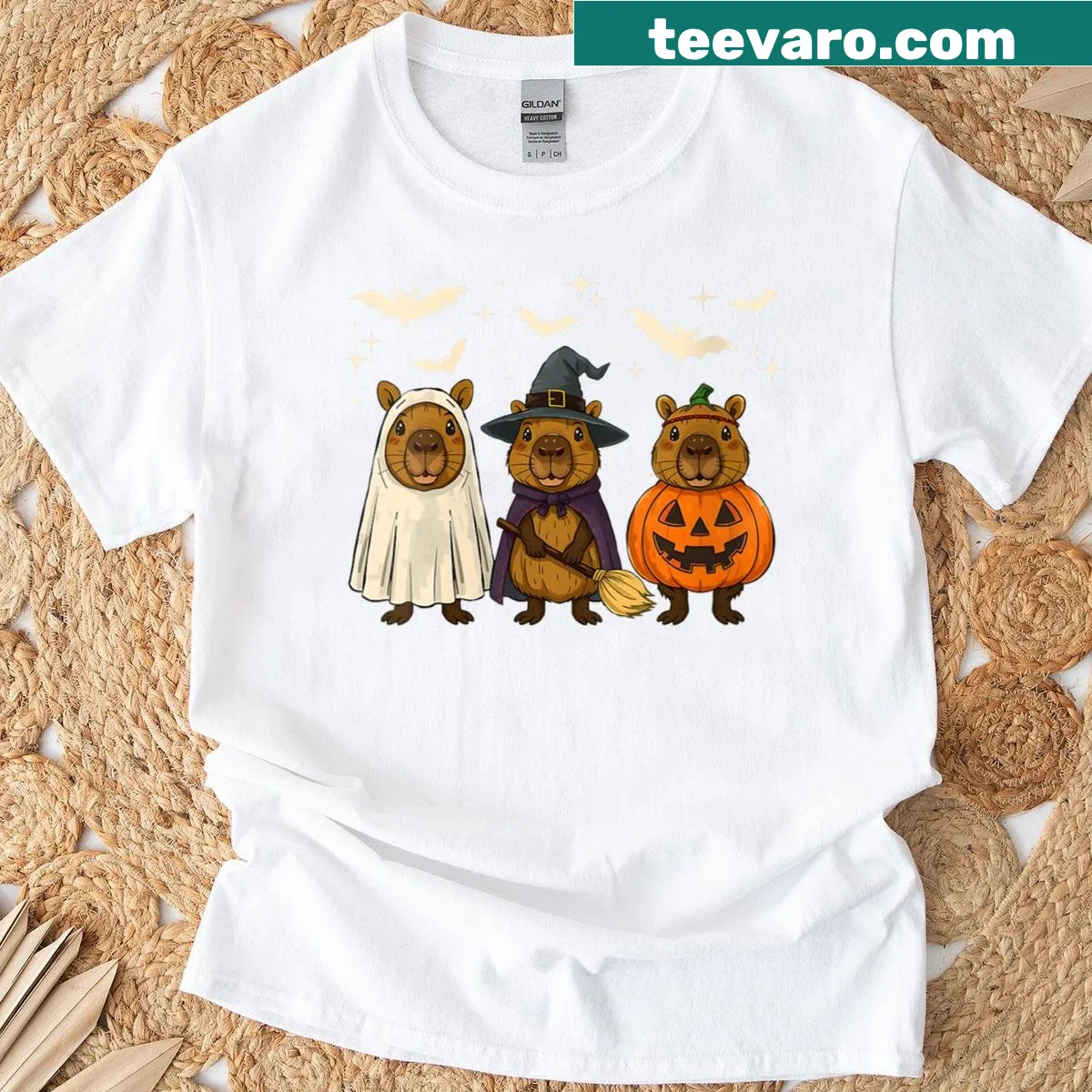 Cartoon Halloween t-shirt featuring capybara ghost and pumpkins — on a men's t-shirt