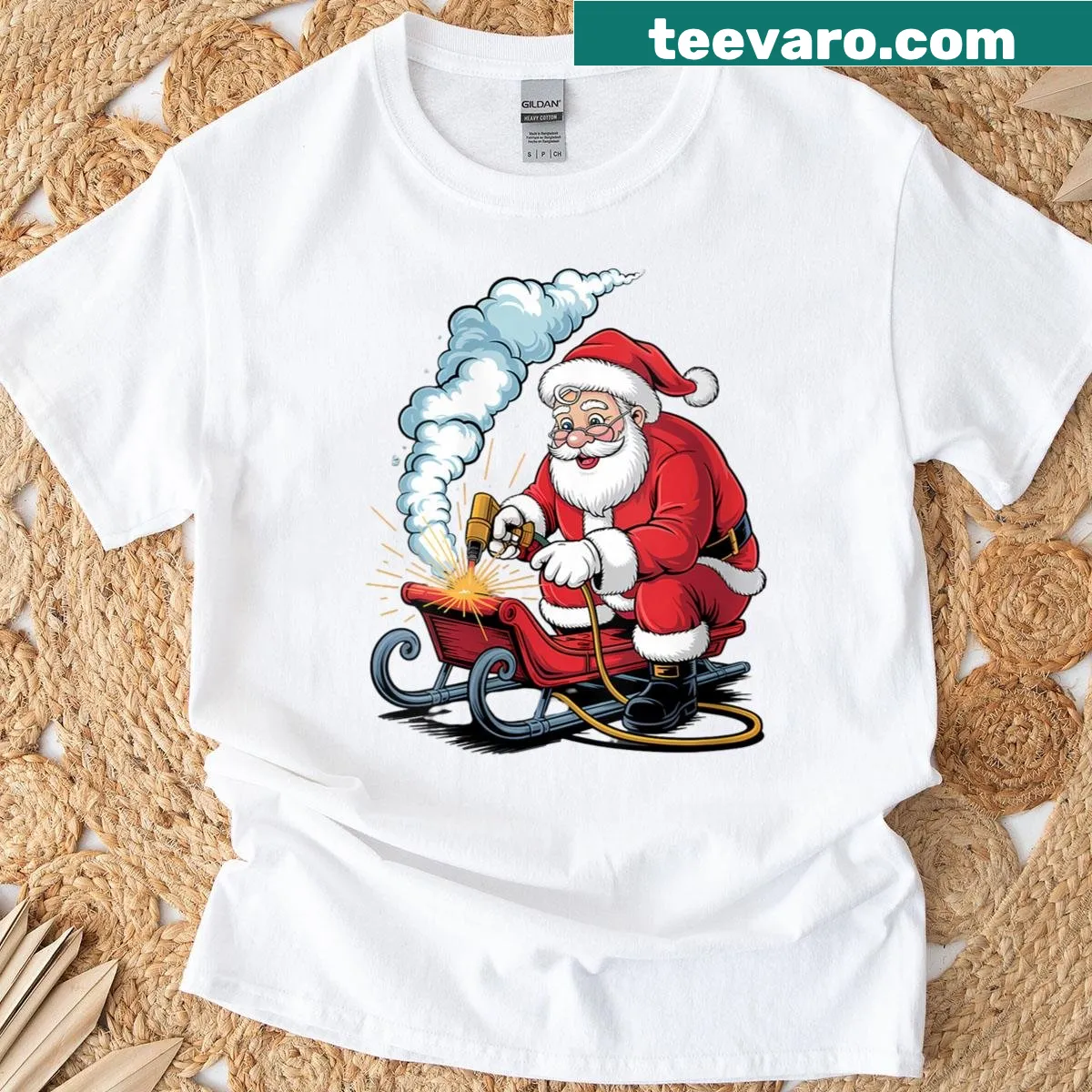 Santa welding his sleigh with a funny cartoon design — on a men's t-shirt
