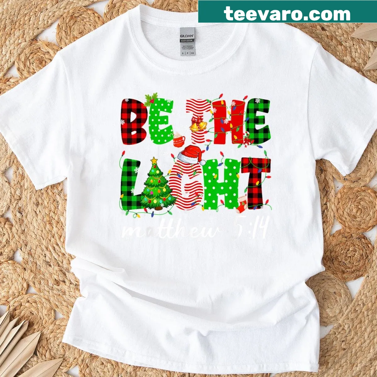 Christian-themed t-shirt with 'Be The Light' typography design — on a men's t-shirt