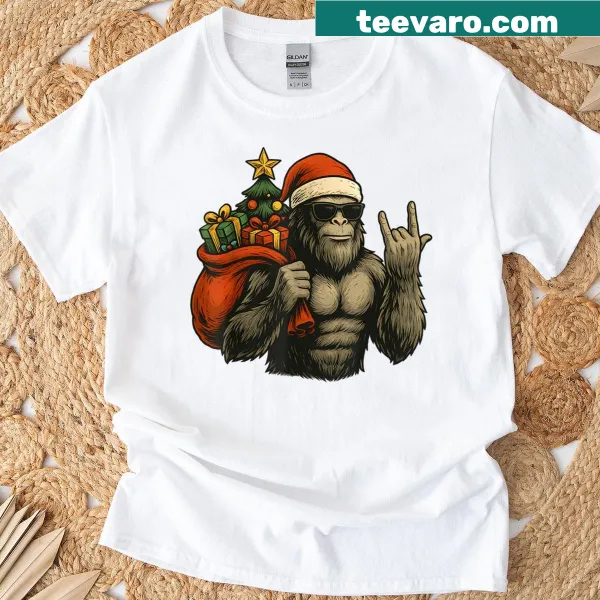 Bigfoot Santa shirt with Sasquatch next to a Christmas tree