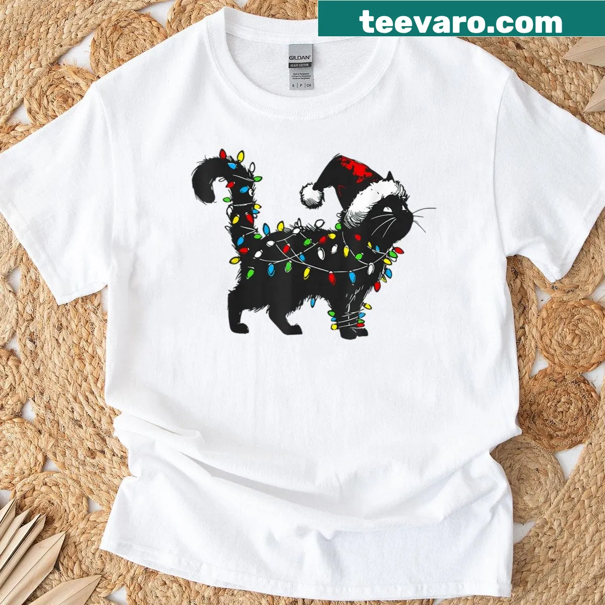 Funny black cat in Santa hat Christmas graphic T-shirt — on a men's t-shirt