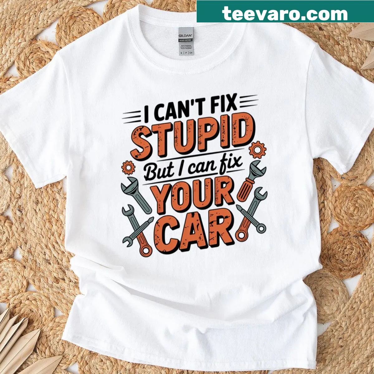 Vintage-style mechanic badge tee with humorous text — on a men's t-shirt