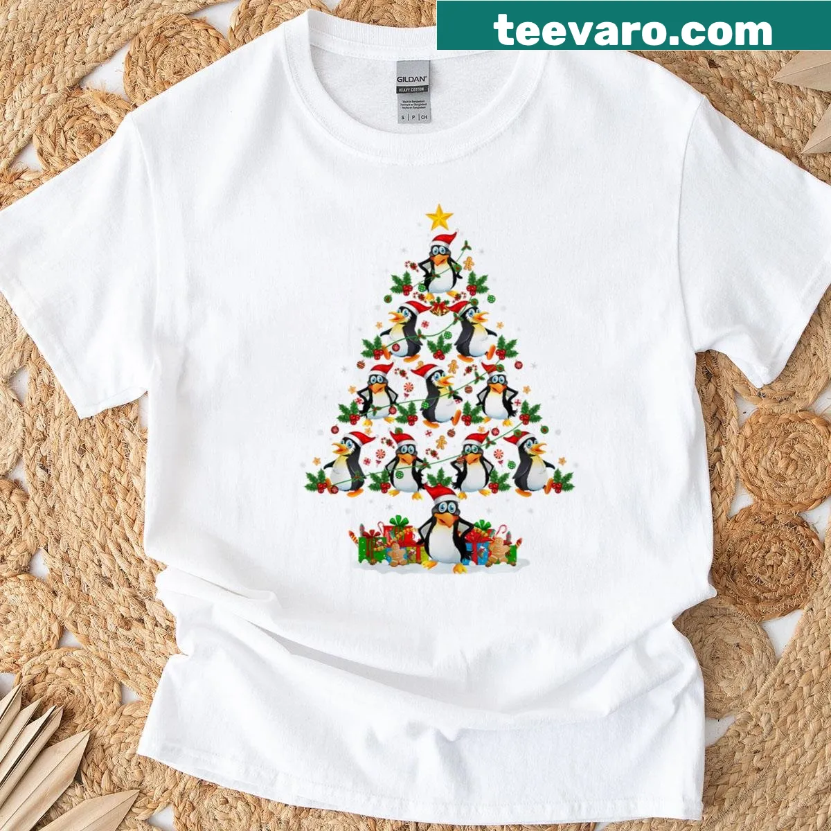 Whimsical penguin surrounded by Christmas lights and Santa. — on a men's t-shirt