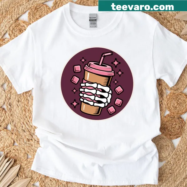 Whimsical Halloween-themed coffee cup graphic on a T-shirt