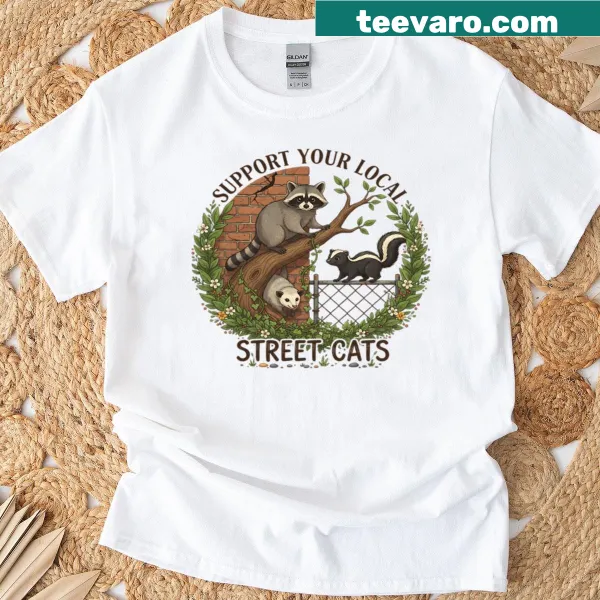 Whimsical t-shirt promoting support for local street cats in an urban setting