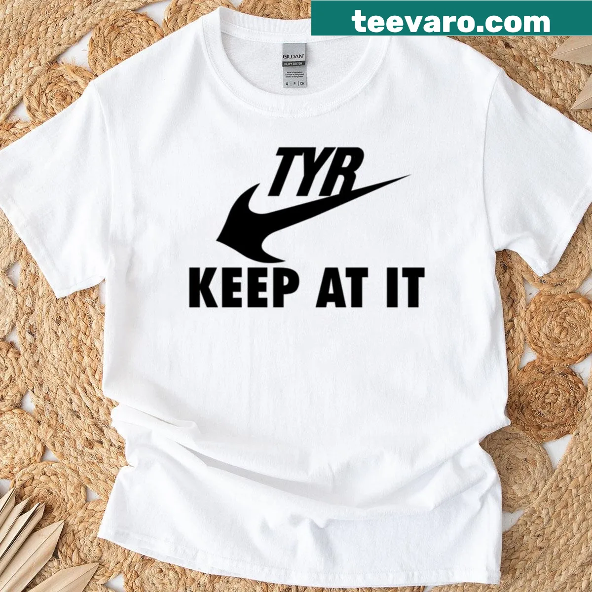 Parody logo t-shirt with 'Tyr Keep At It' text — on a men's t-shirt