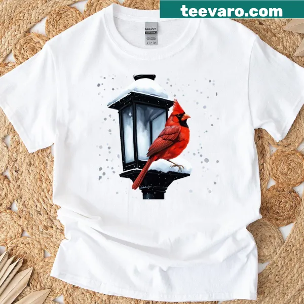 T-shirt featuring a winter scene with a cardinal bird for the holidays