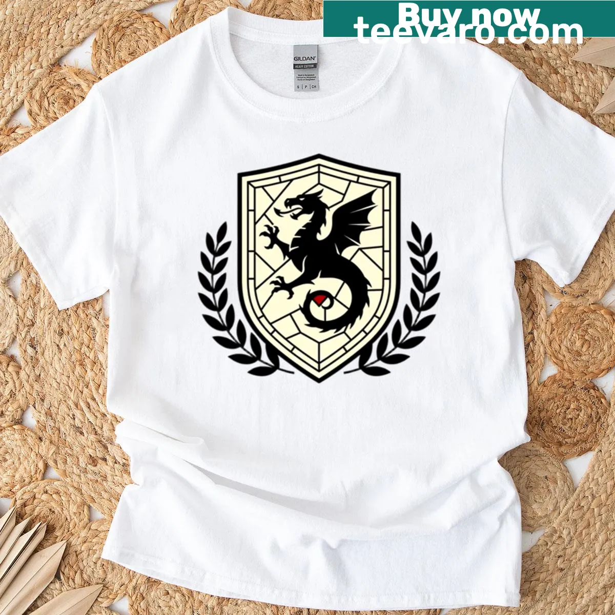 Black dragon crest on ivory shield design — on a men's t-shirt