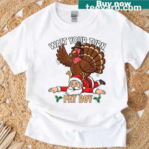 Humorous turkey vs Santa graphic on a holiday t-shirt.