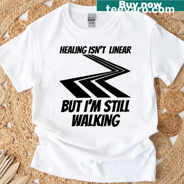 Empowering T-shirt featuring 'Healing Isn't Linear' mental wellness message