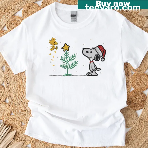 Cute Christmas tee featuring Snoopy and Woodstock decorating a tree