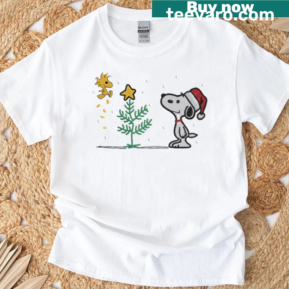Cute Christmas tee featuring Snoopy and Woodstock decorating a tree — on a men's t-shirt