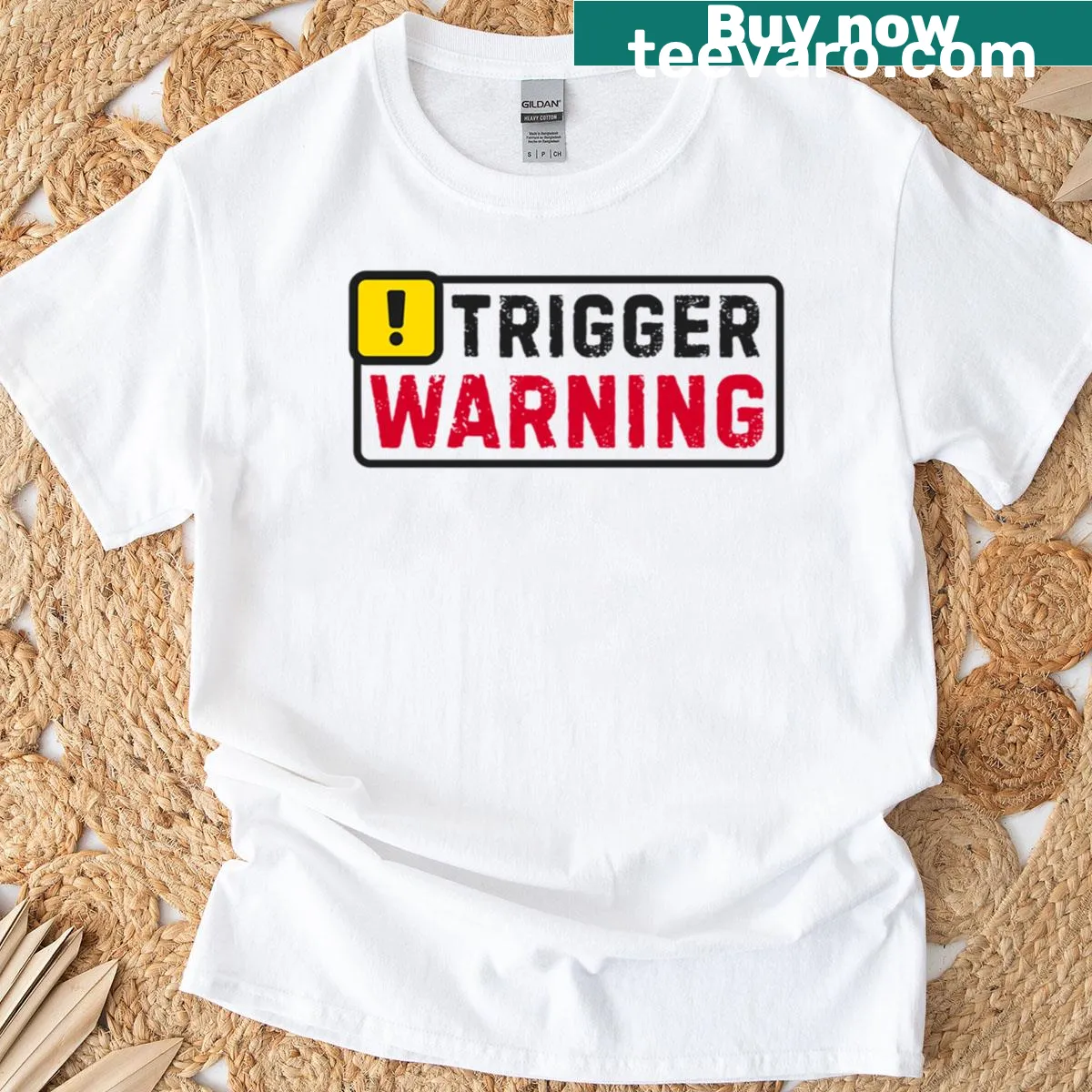Hazard sign design on a t-shirt with 'Trigger Warning' text — on a men's t-shirt