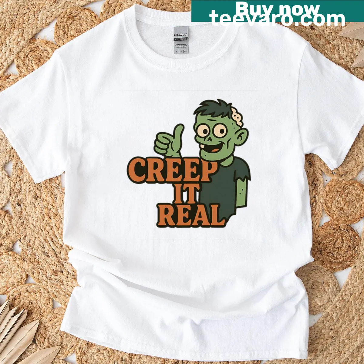 Funny Halloween t-shirt with cartoon zombie and text "Creep It Real" — on a men's t-shirt