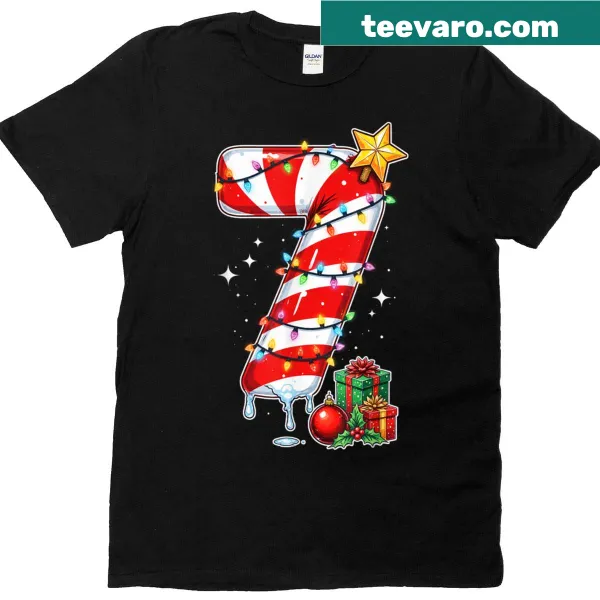 Couples Christmas shirt with fun '67' meme and tree lights graphic.